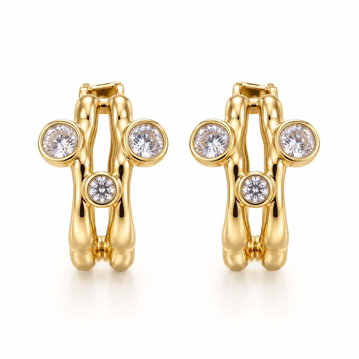 Arete Doble banda tres Zirconias  oro laminado